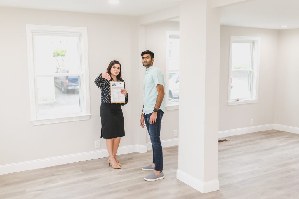 home buyer being shown around by an agent
